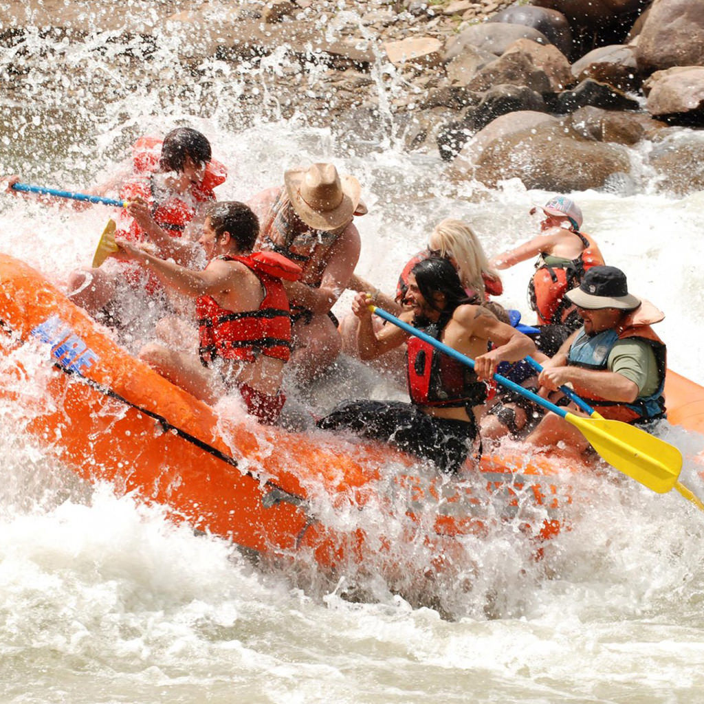 young group on a wild rafting trip